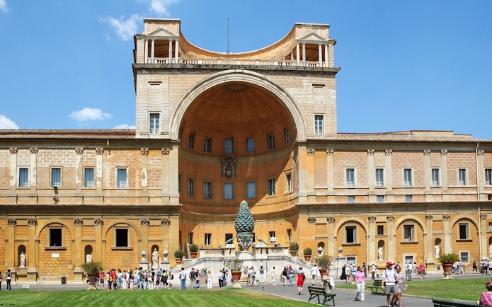 Vatican Museum exterior with courtyard and visitors in Rome, Italy.