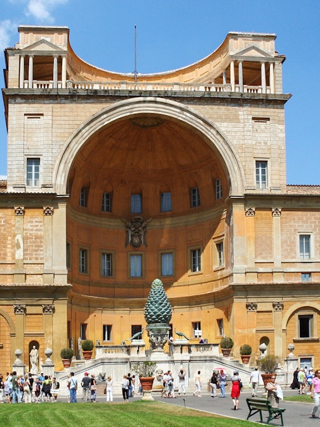 Vatican Museum exterior with courtyard and visitors in Rome, Italy.