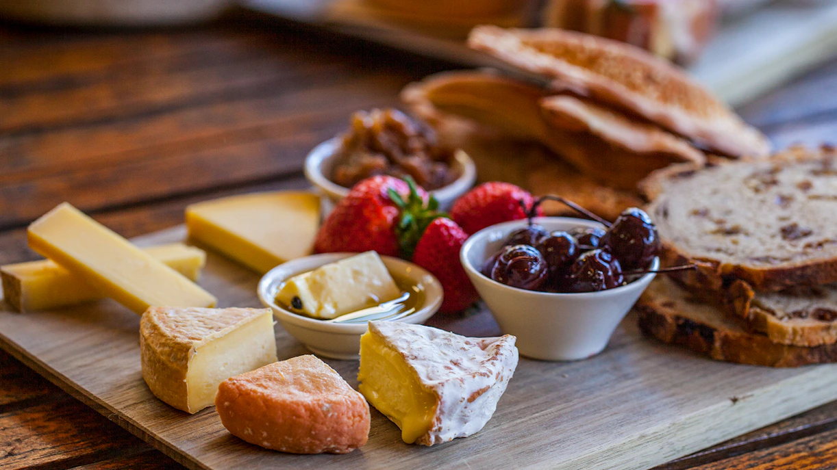 Gourmet cheese and fruit platter on Bruny Island tour.