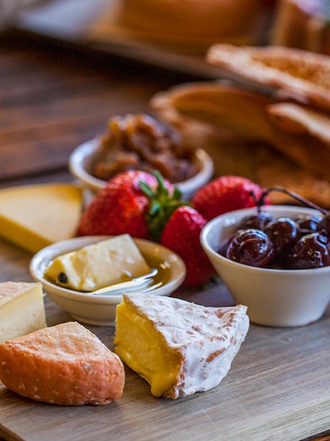 Gourmet cheese and fruit platter on Bruny Island tour.