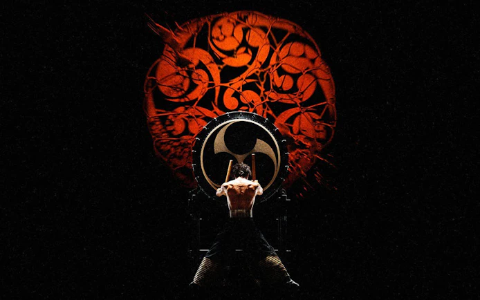 Performer playing taiko drum at DRUM TAO Theater in Kyoto.