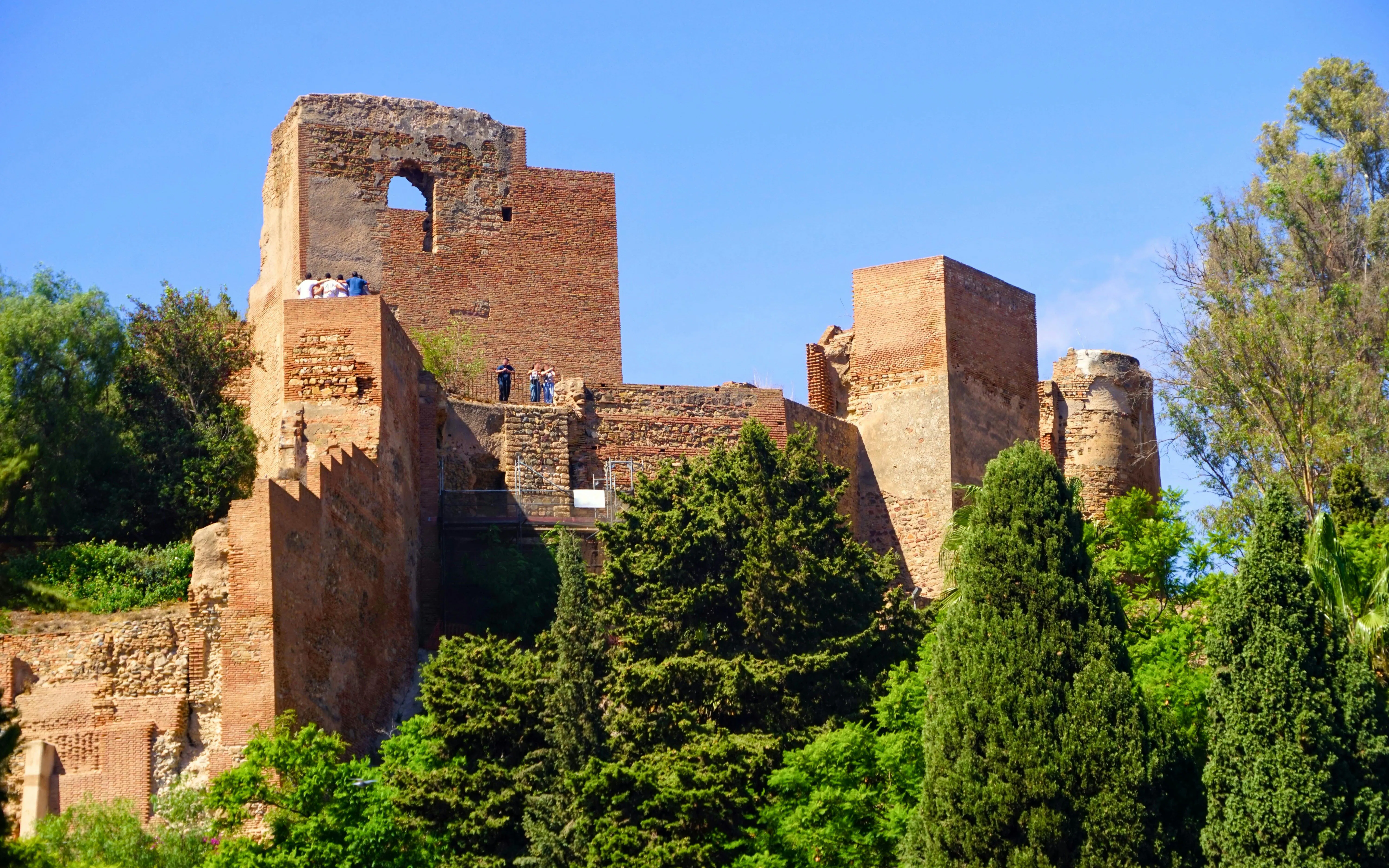 Castillo de Gibralfaro ruins with visitors, Málaga, Costa del Sol, Andalusia, Spain.
