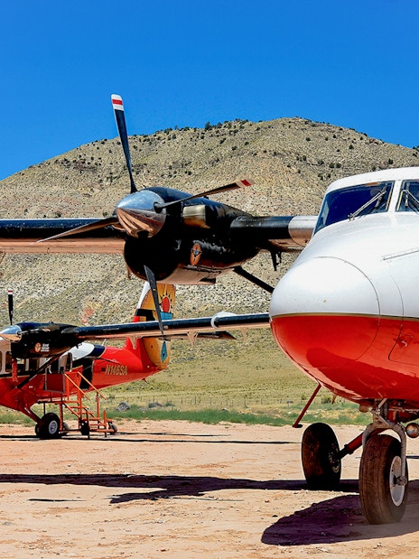 Twin-engine planes on the ground at North Rim, ready for helicopter tour.
