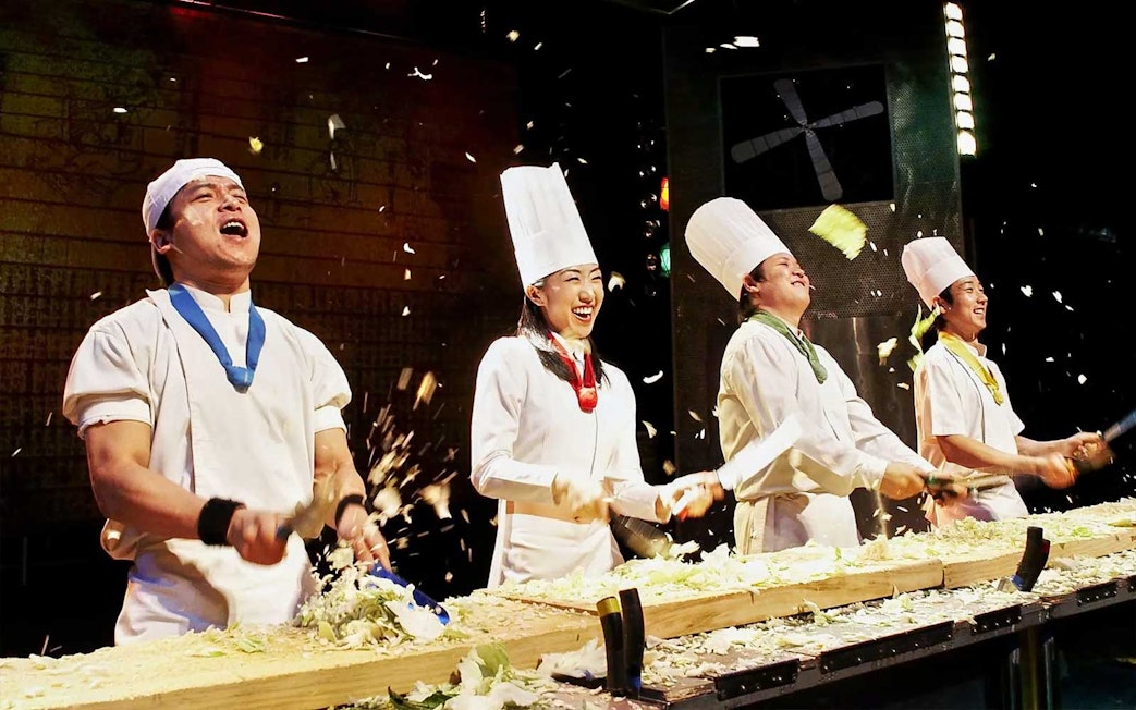 Chefs performing on stage at Seoul Myeongdong Nanta Musical Show.