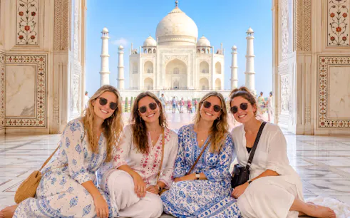 Visitors at the Taj Mahal entrance, Agra, with the monument in the background.