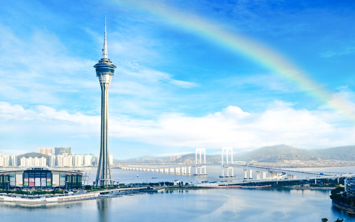 Macau Tower Observation Deck with rainbow in the sky.