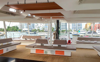 Catamaran deck with seating and marina view in Cartagena.