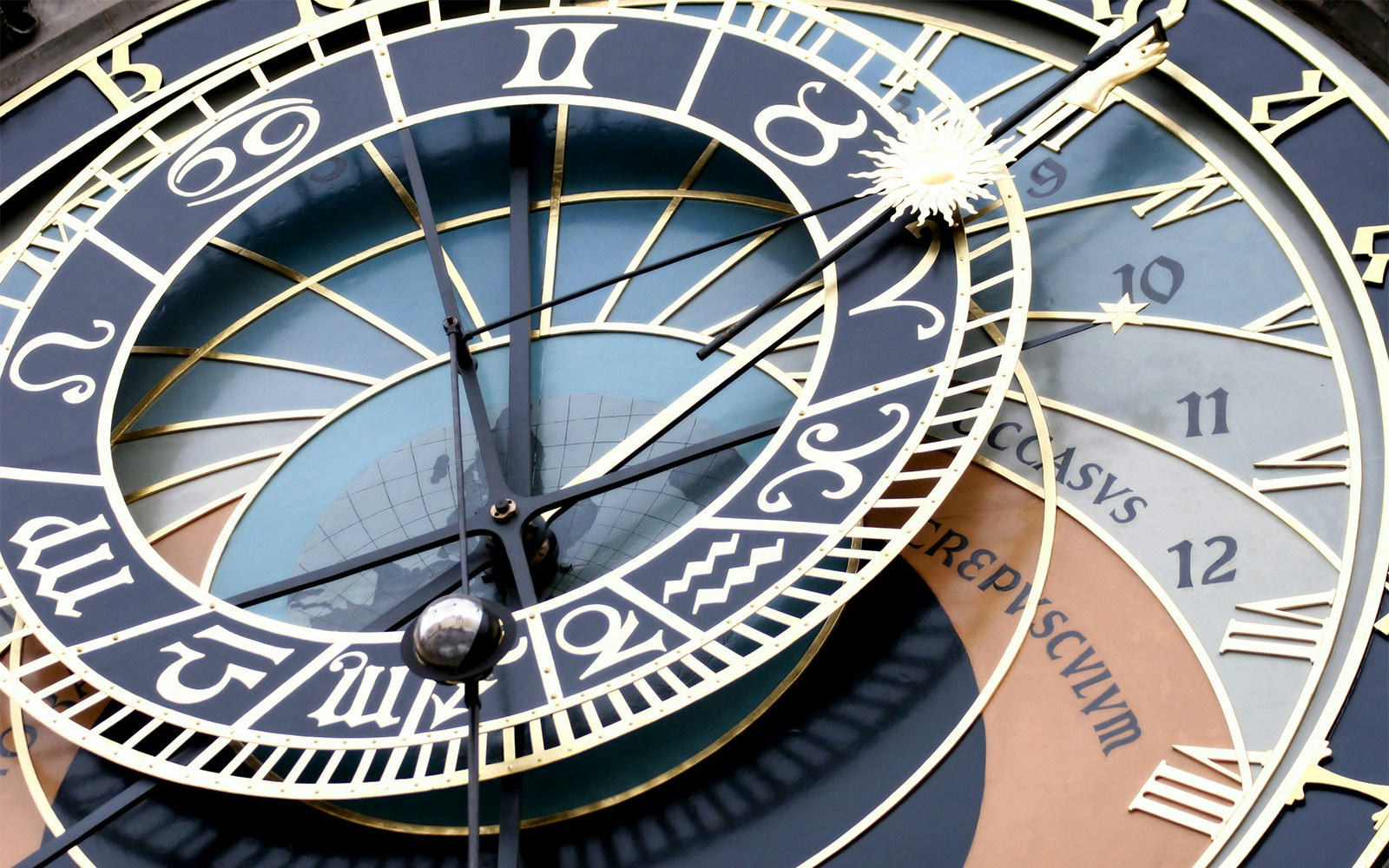 Prague Astronomical Clock face with zodiac signs and Roman numerals.