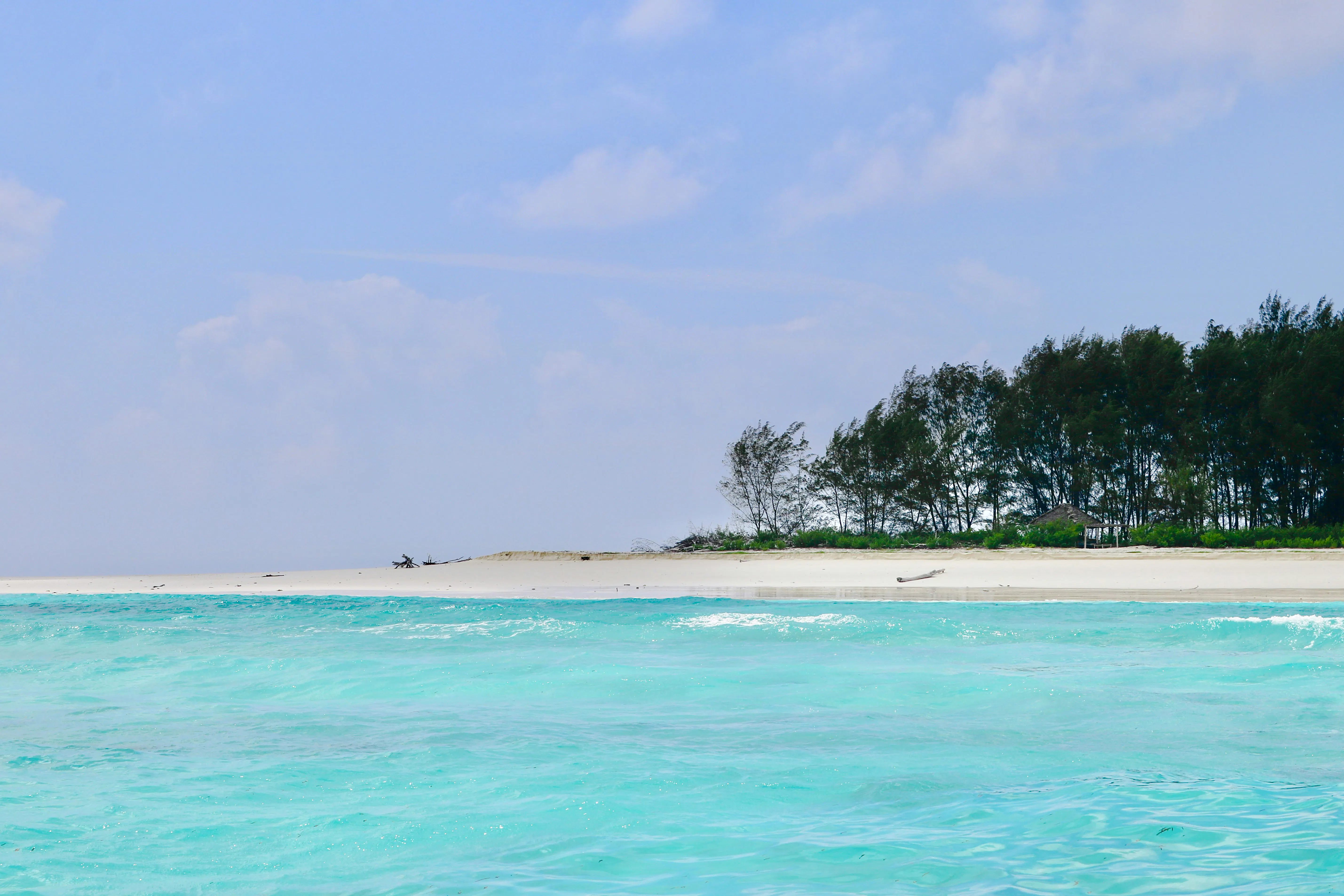 Turquoise waters and sandy beach of Mnemba Island Atoll, Zanzibar.
