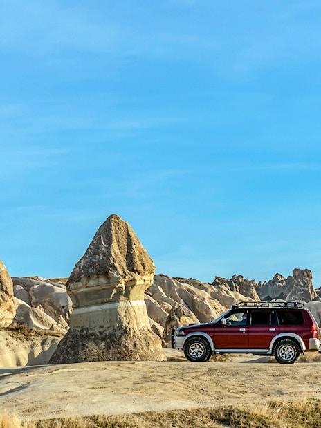 Jeep on Cappadocia landscape during private safari tour.
