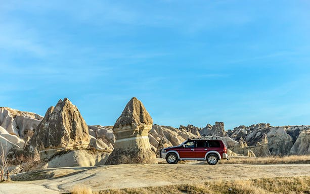Jeep on Cappadocia landscape during private safari tour.