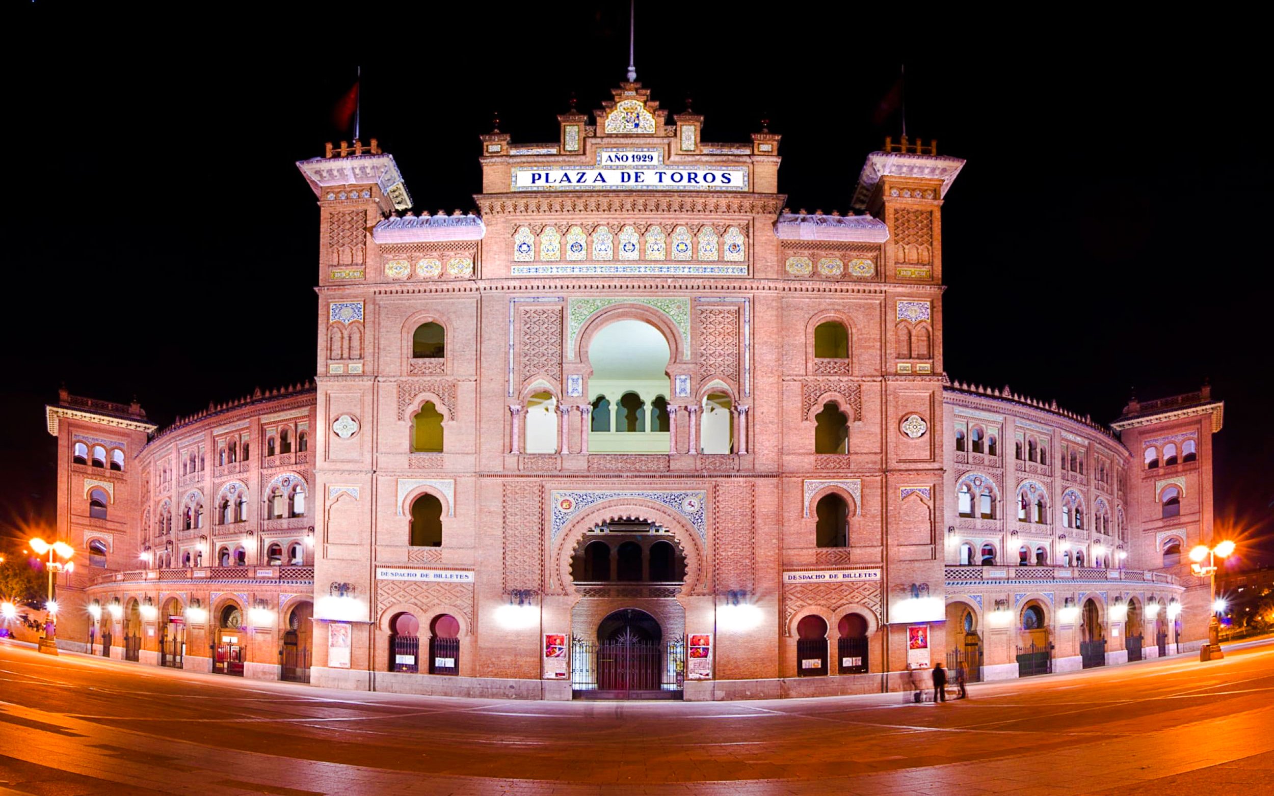 Plaza de Toros de Las Ventas illuminated at night in Madrid, Spain.