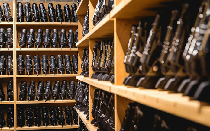 Ice skates neatly arranged on shelves in FC Barcelona Ice Rink equipment room.
