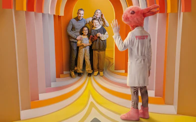 Guests interacting with a rabbit character at the Twist Museum in London.