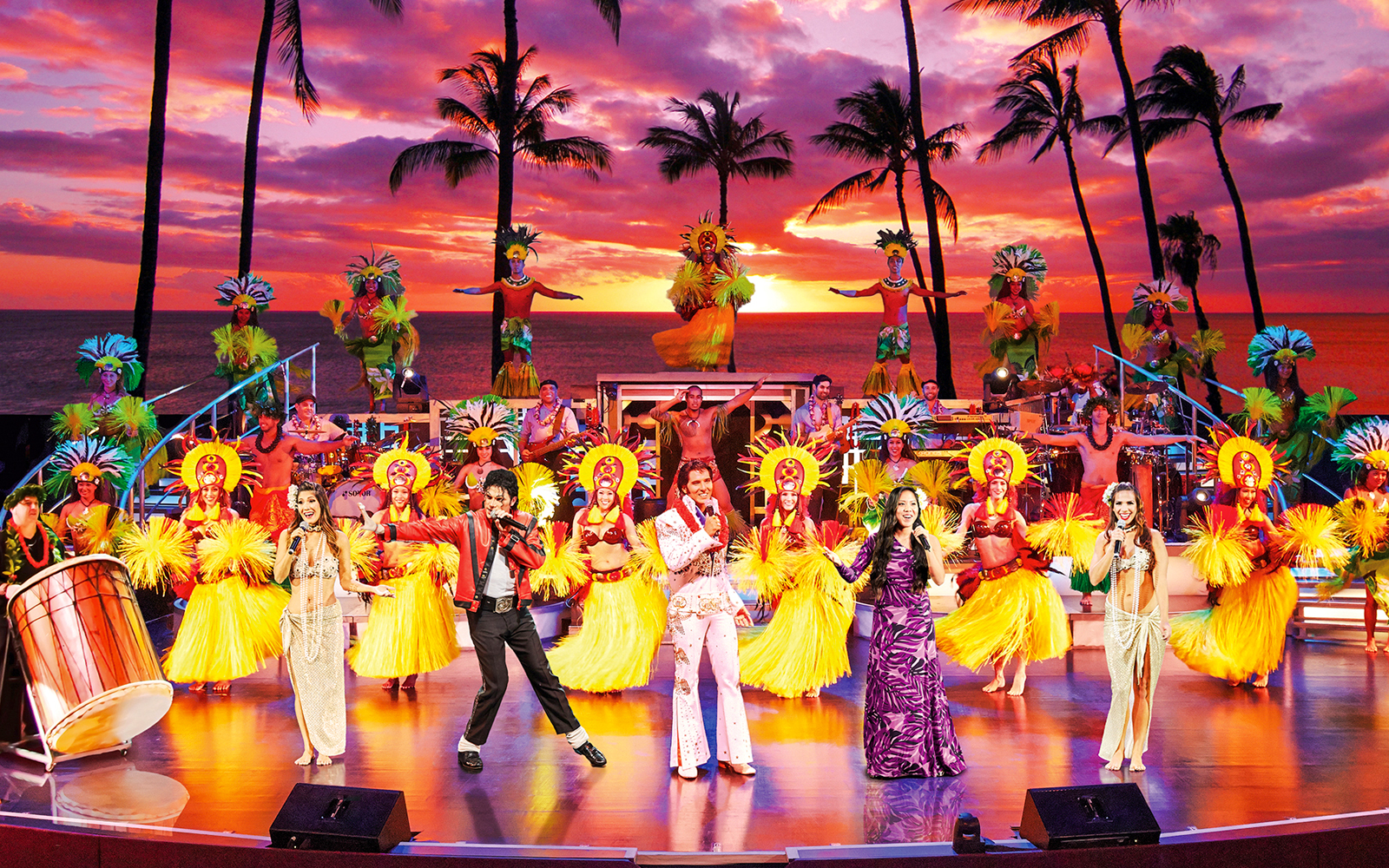 Performers in traditional Hawaiian attire on stage at RockAHula Show, Honolulu.
