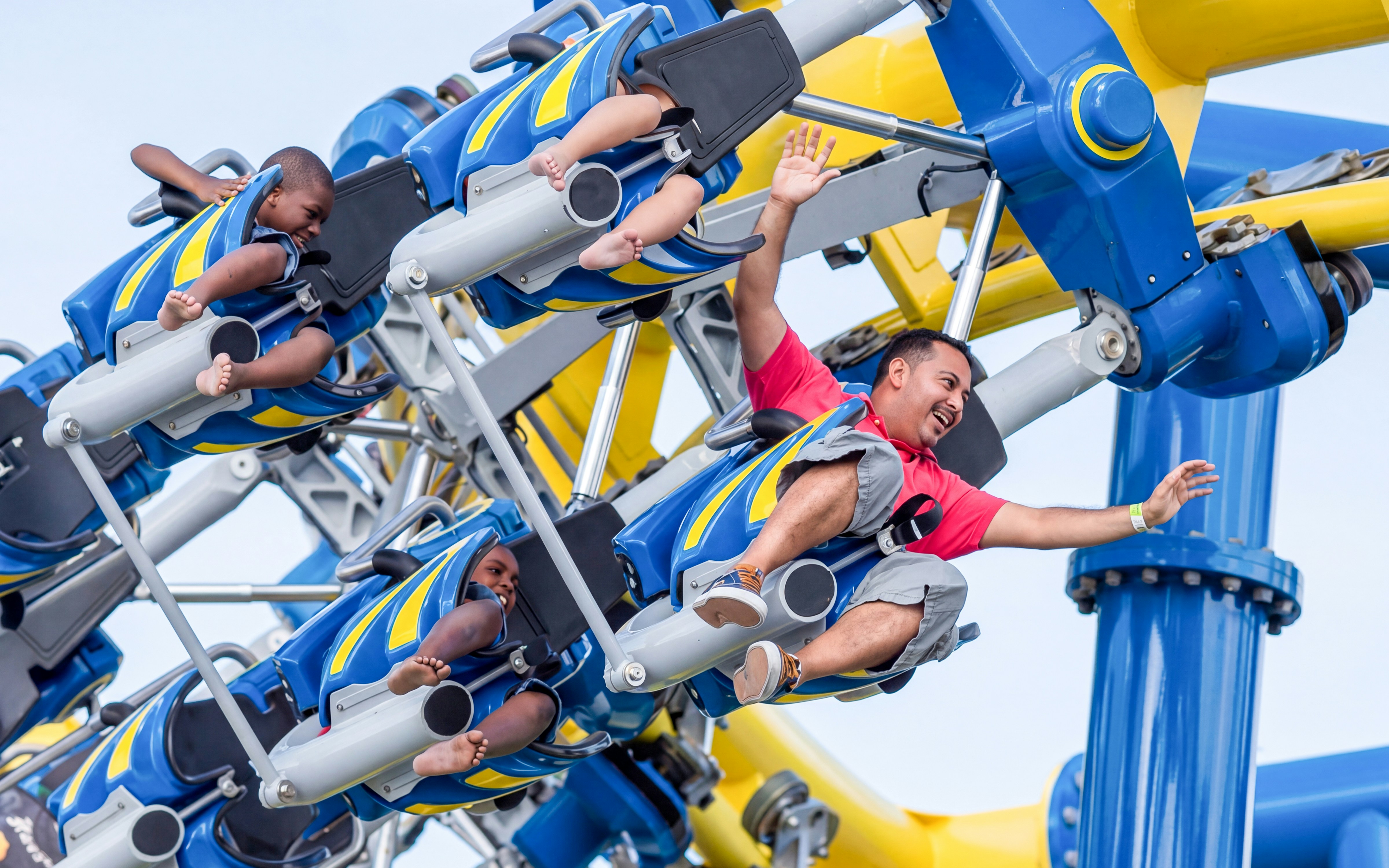 Riders enjoying the Freedom Flyer roller coaster at Fun Spot America Orlando.