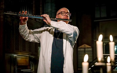 Flutist performing at Midnight Concert in Tromsø Cathedral, Norway.
