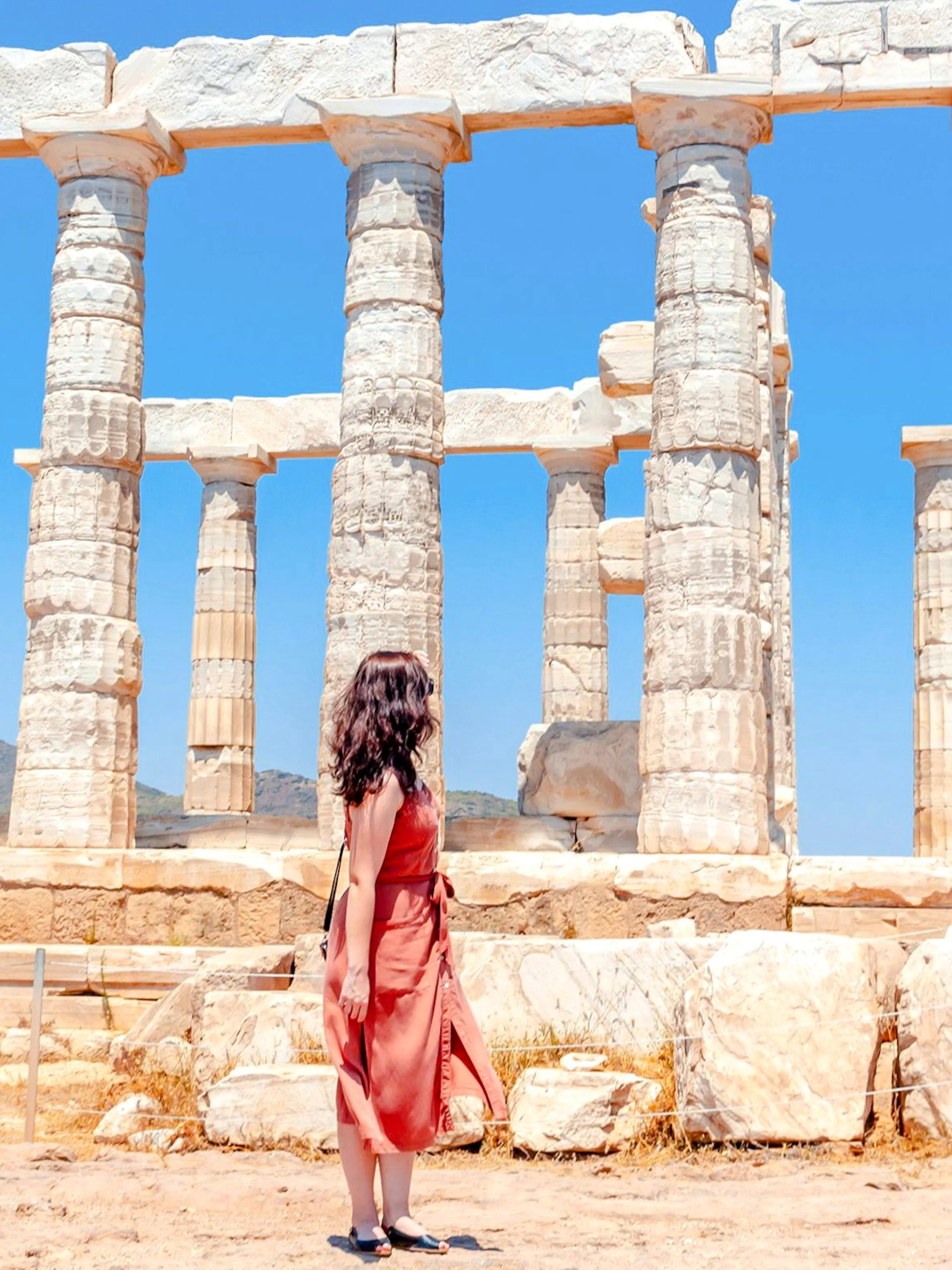 Guest exploring the Temple of Poseidon in Athens, Greece.