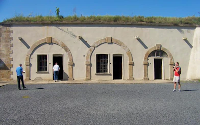 Visitors exploring the courtyard of Terezin Concentration Camp.
