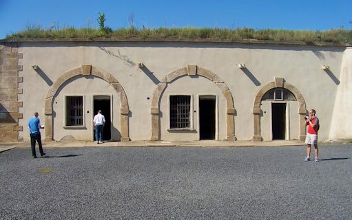 Visitors exploring the courtyard of Terezin Concentration Camp.