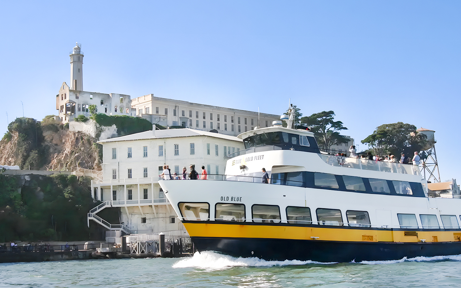 Guests viewing Alcatraz Island from a boat during San Francisco Bay Cruise.