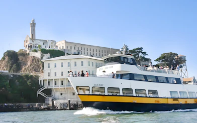 Guests viewing Alcatraz Island from a boat during San Francisco Bay Cruise.