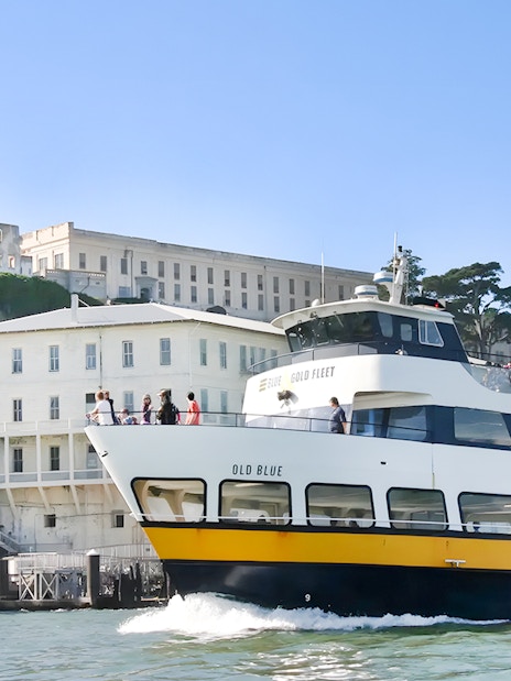 Guests viewing Alcatraz Island from a boat during San Francisco Bay Cruise.