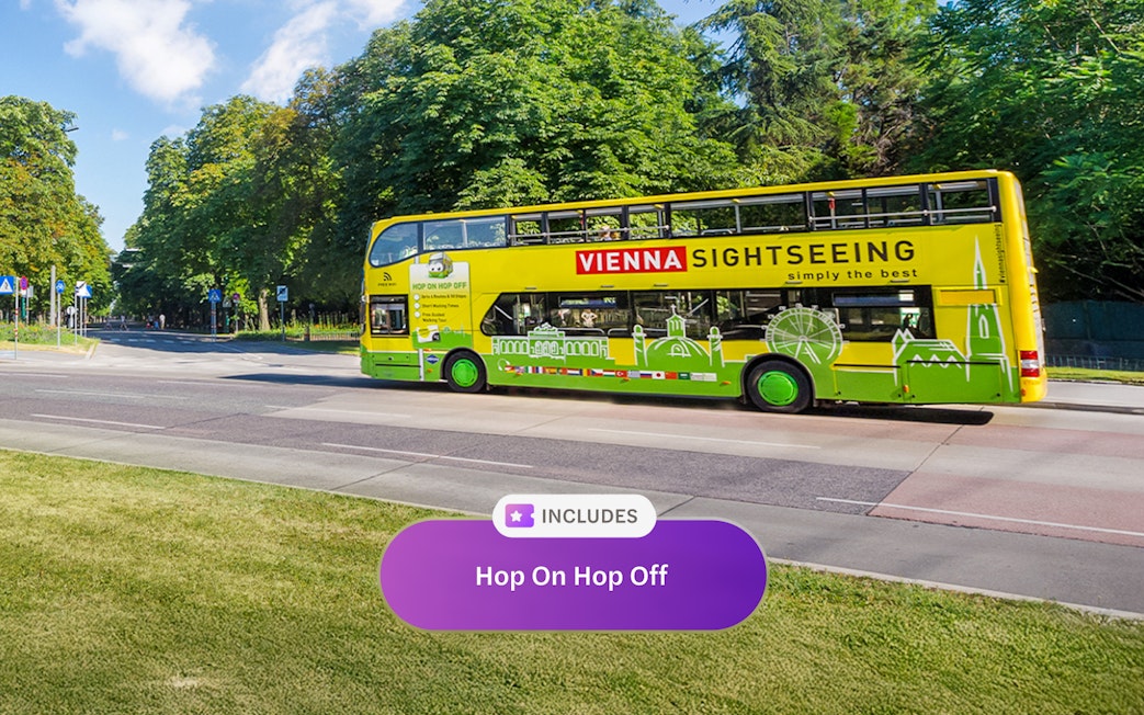 Vienna sightseeing bus on city street, part of Vienna Flexi Pass tour.