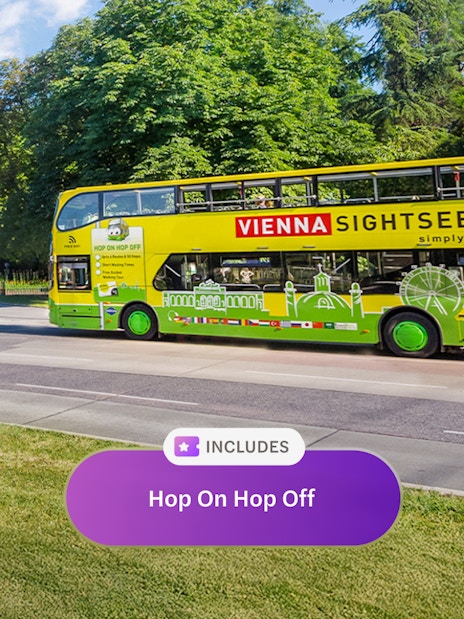 Vienna sightseeing bus on city street, part of Vienna Flexi Pass tour.