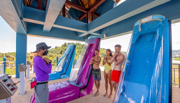 Staff guiding visitors on safety for Naga Jungle slide at Andamanda Phuket.