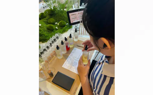 Perfume making workshop setup with bottles and ingredients in Da Nang.