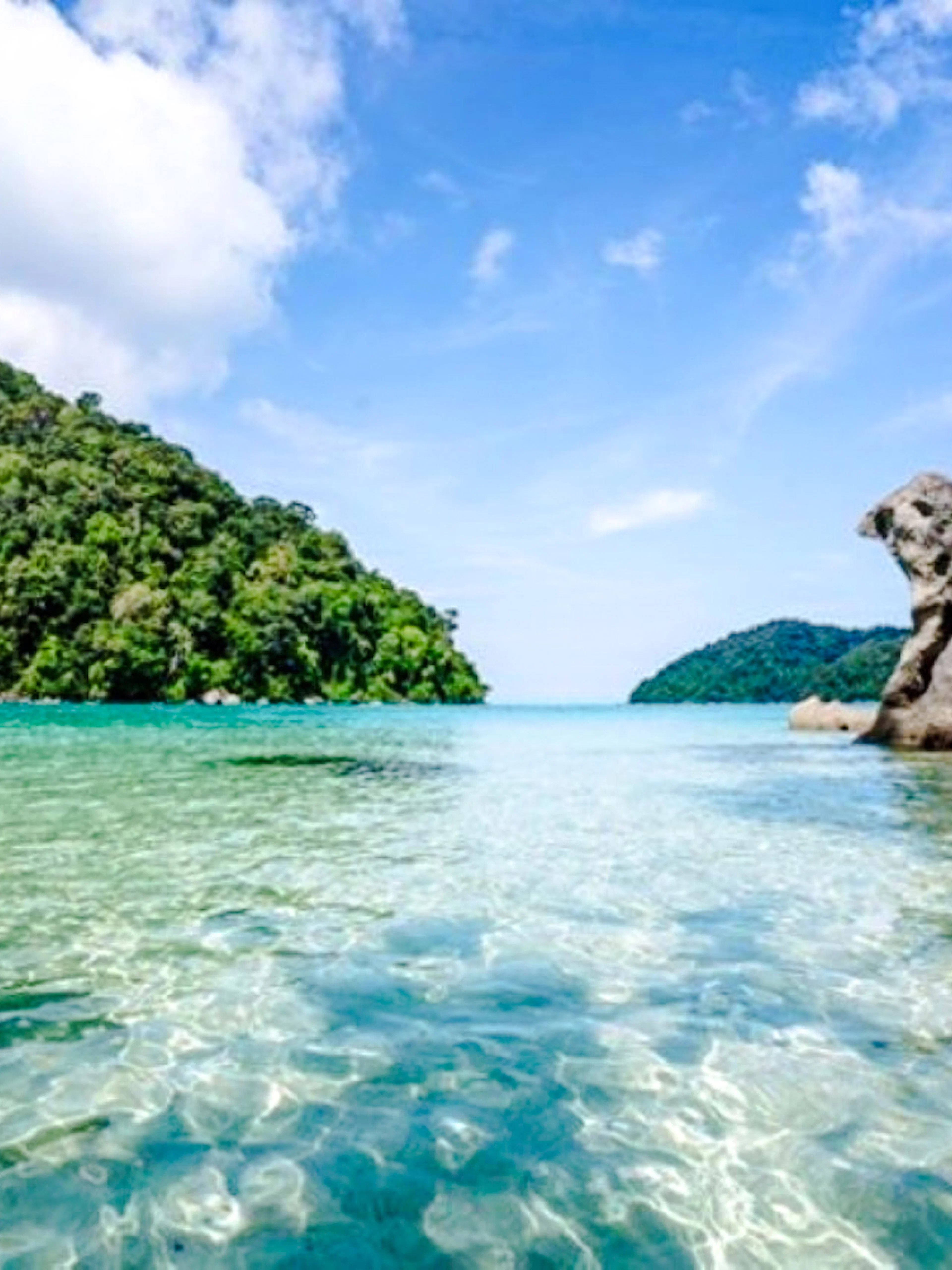 Surin Islands clear waters and rock formations, Krabi day tour.