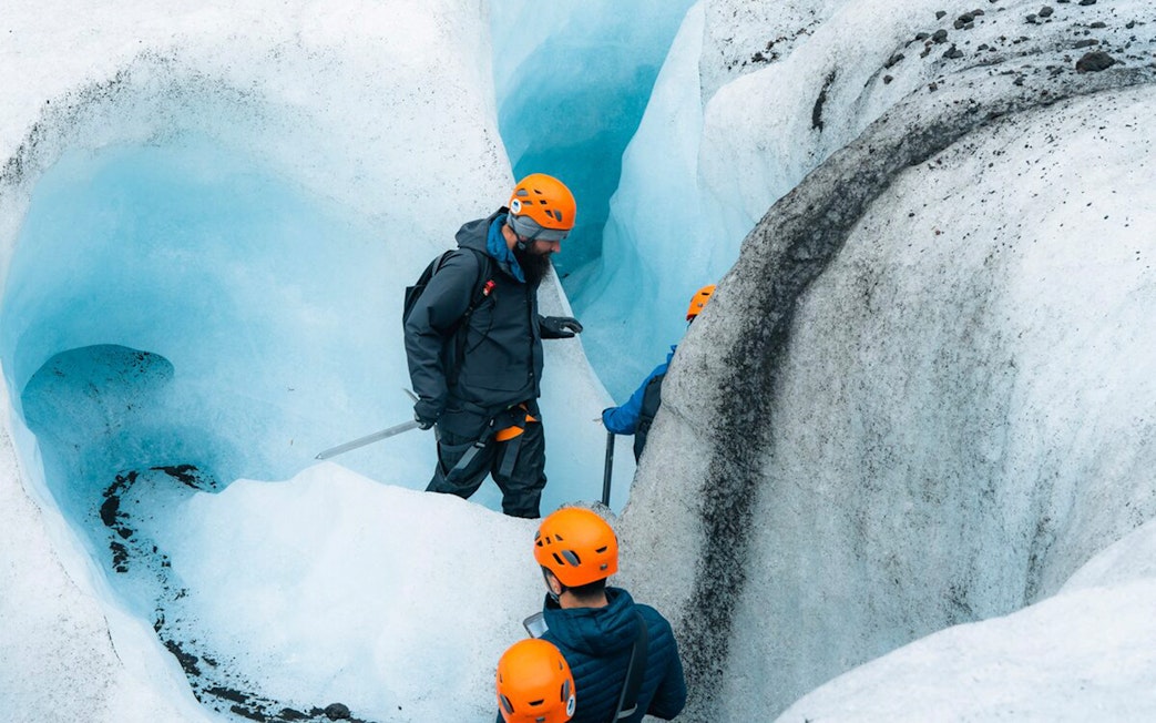 Guests exploring inside Blue Ice Cave in Vatnajökull, Iceland.