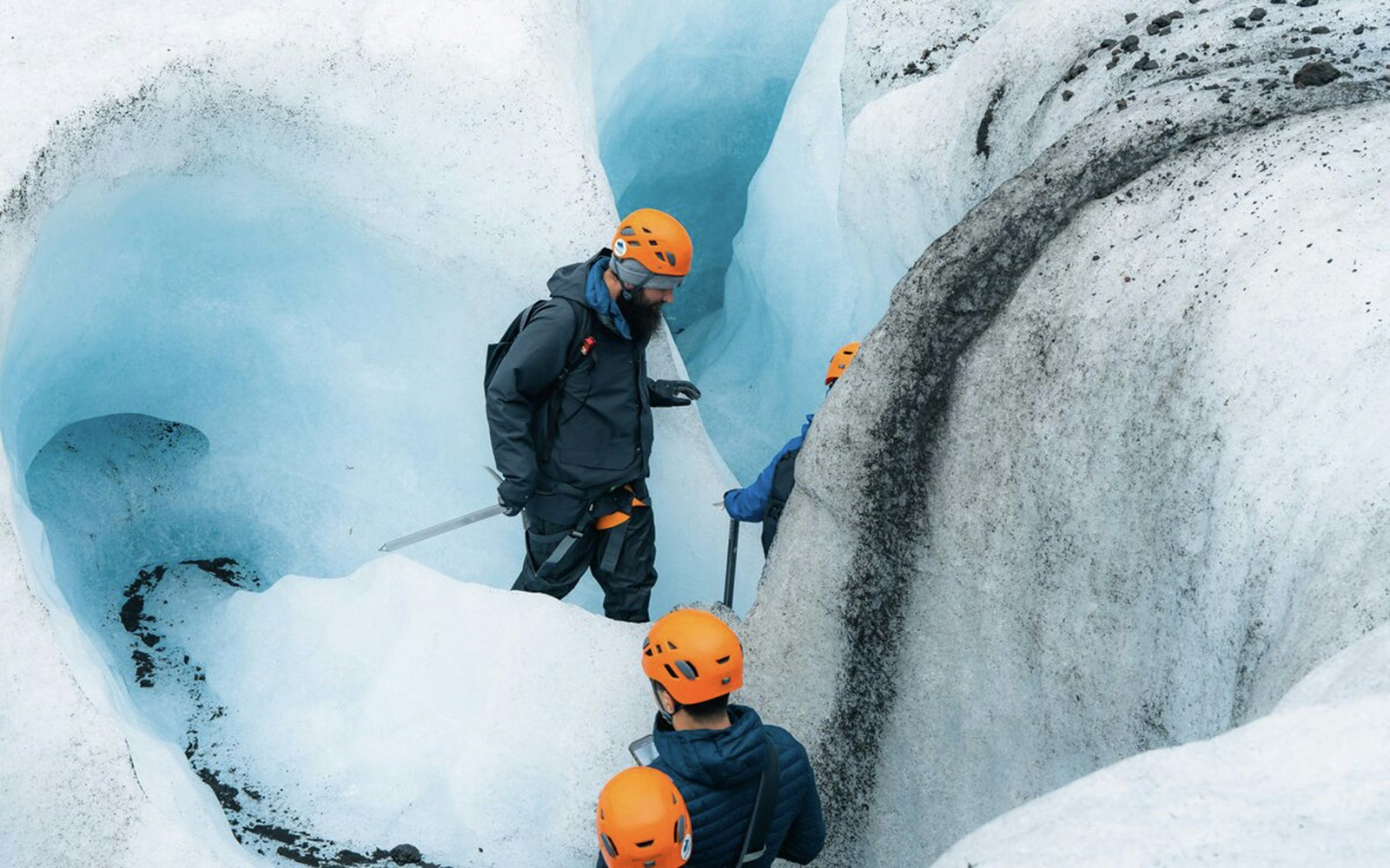 Guests exploring inside Blue Ice Cave in Vatnajökull, Iceland.