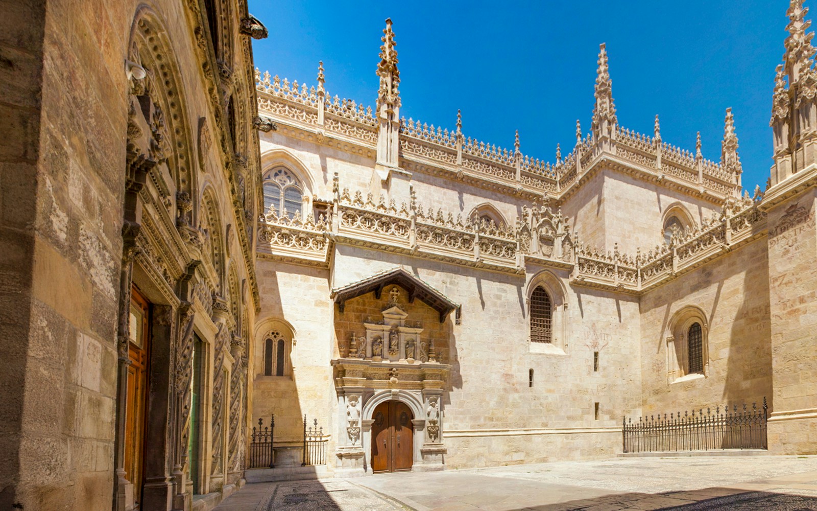 Royal Chapel exterior at Granada Cathedral with ornate Gothic architecture.