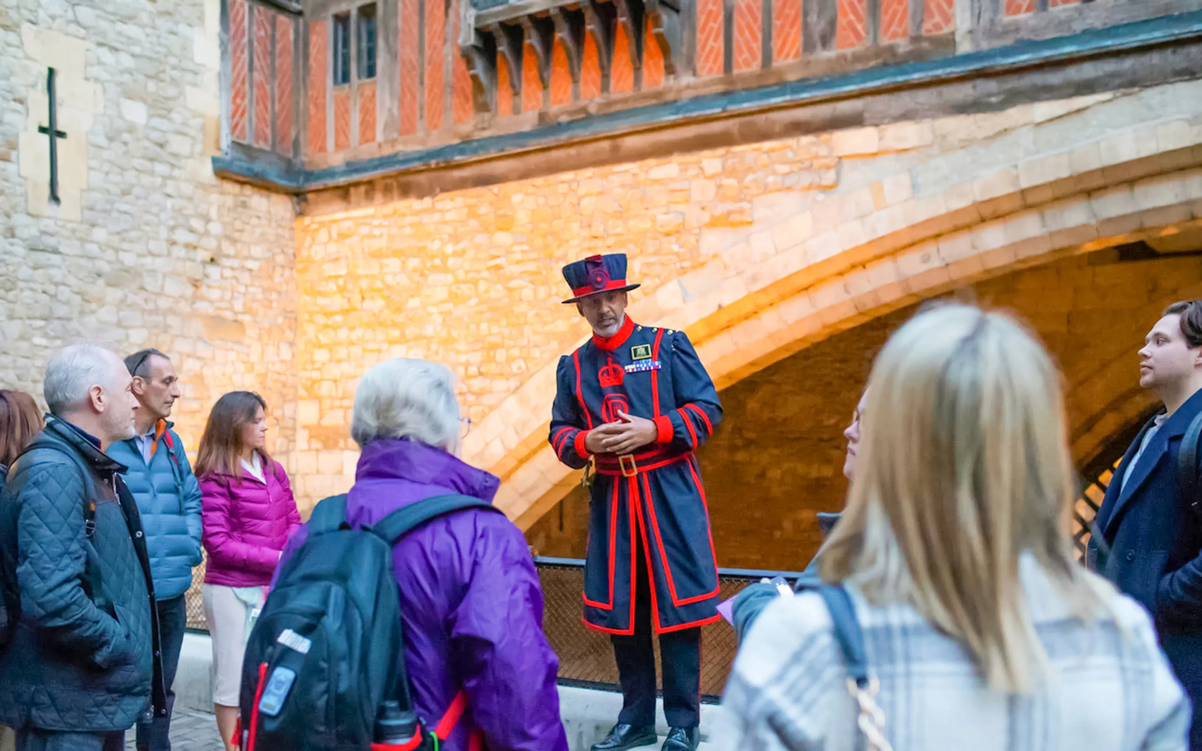 Beefeater guiding a group during the VIP Tower of London after-hours tour.