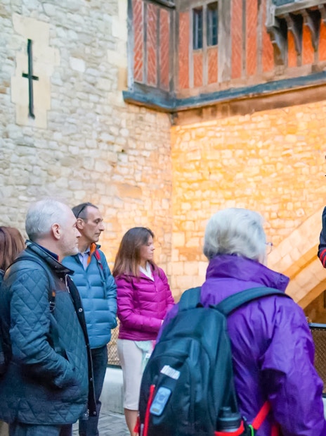 Beefeater guiding a group during the VIP Tower of London after-hours tour.