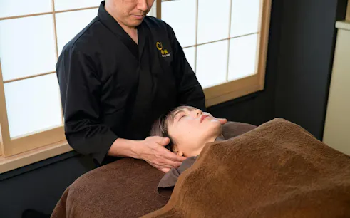 Forehead massage in Hiroshima during Japanese massage session for two.