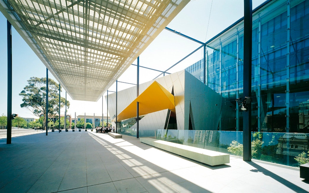 Melbourne Museum entrance with modern architecture and glass facade.