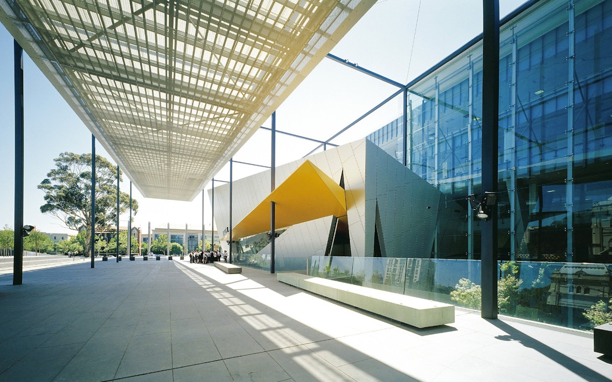 Melbourne Museum entrance with modern architecture and glass facade.
