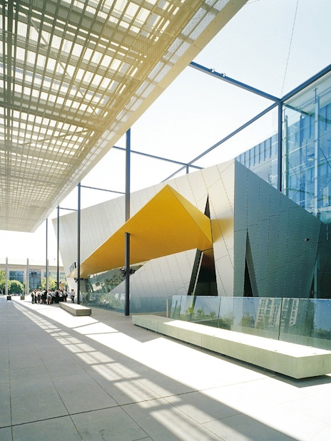 Melbourne Museum entrance with modern architecture and glass facade.