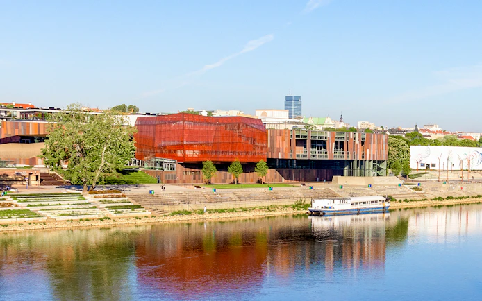 Copernicus Science Center in Warsaw with river view and modern architecture.