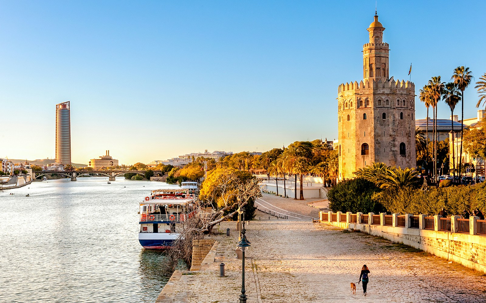 View of Golden Tower (Torre del Oro) of Seville, Andalusia, Spain over river Guadalquivir at sunset