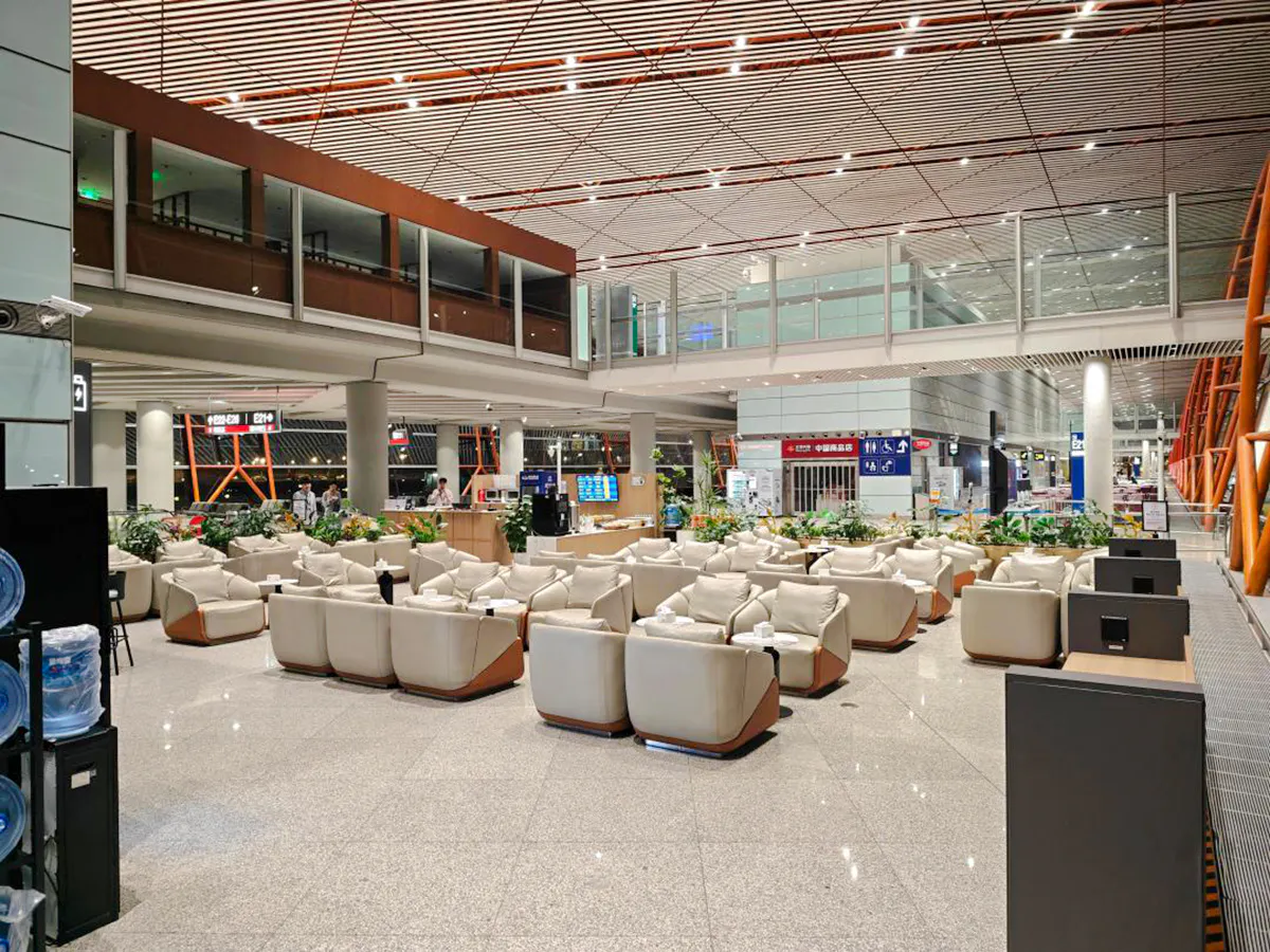 Beijing Capital International Airport lounge seating area in Terminal 3 with modern decor.
