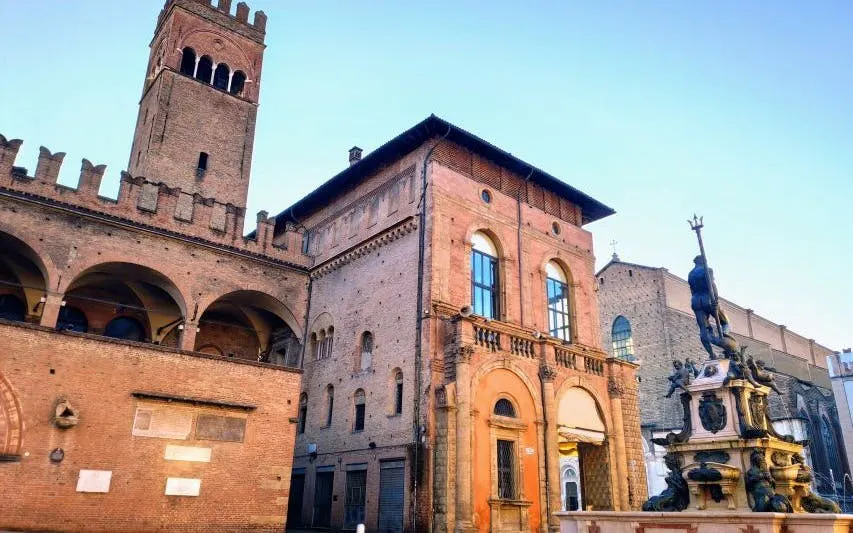 Bologna's Neptune Fountain and medieval architecture on self-guided murder mystery tour.