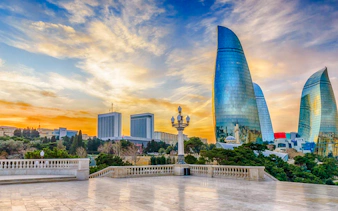 Flame Towers and cityscape at sunset, Baku City Tour, Baku.