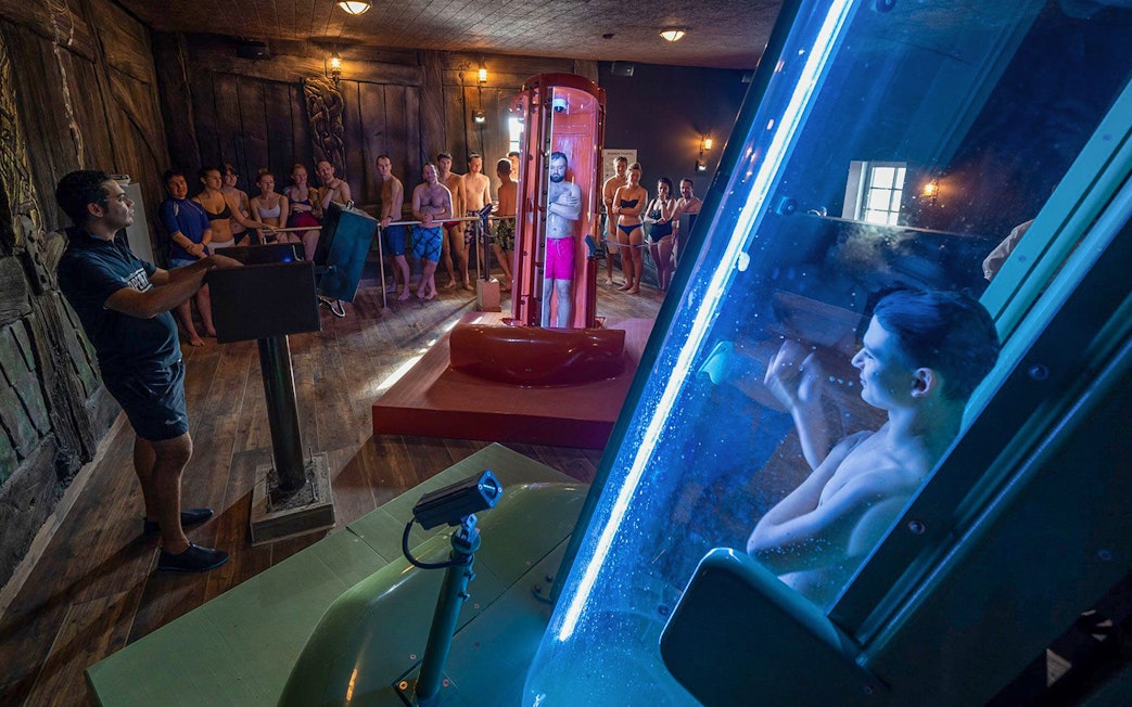 Visitors at Rulantica water park preparing for a water slide experience.