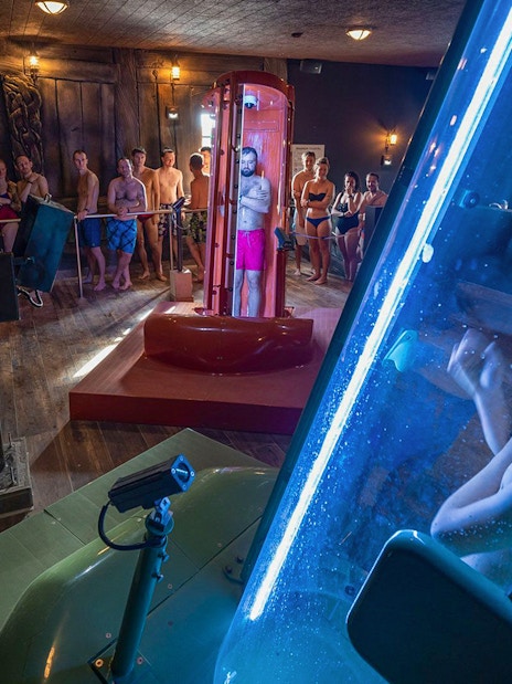 Visitors at Rulantica water park preparing for a water slide experience.