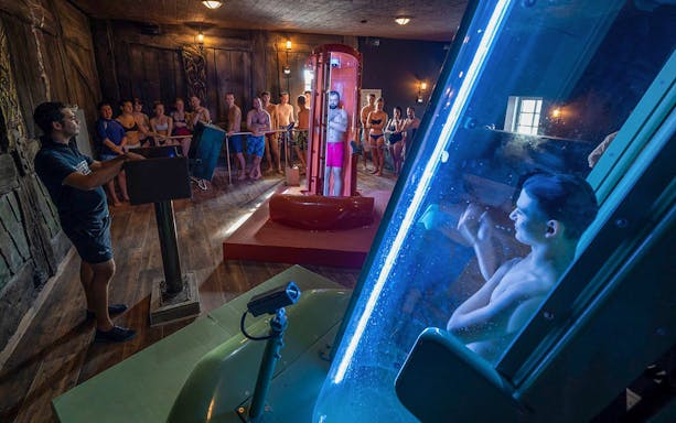 Visitors at Rulantica water park preparing for a water slide experience.