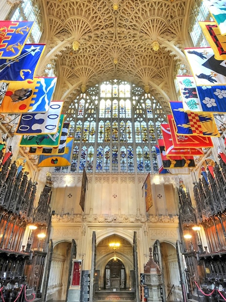 The Lady Chapel interior with ornate ceiling and colorful banners, Westminster Abbey.